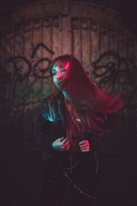 a girl with long hair and bright pink lights in her eyes