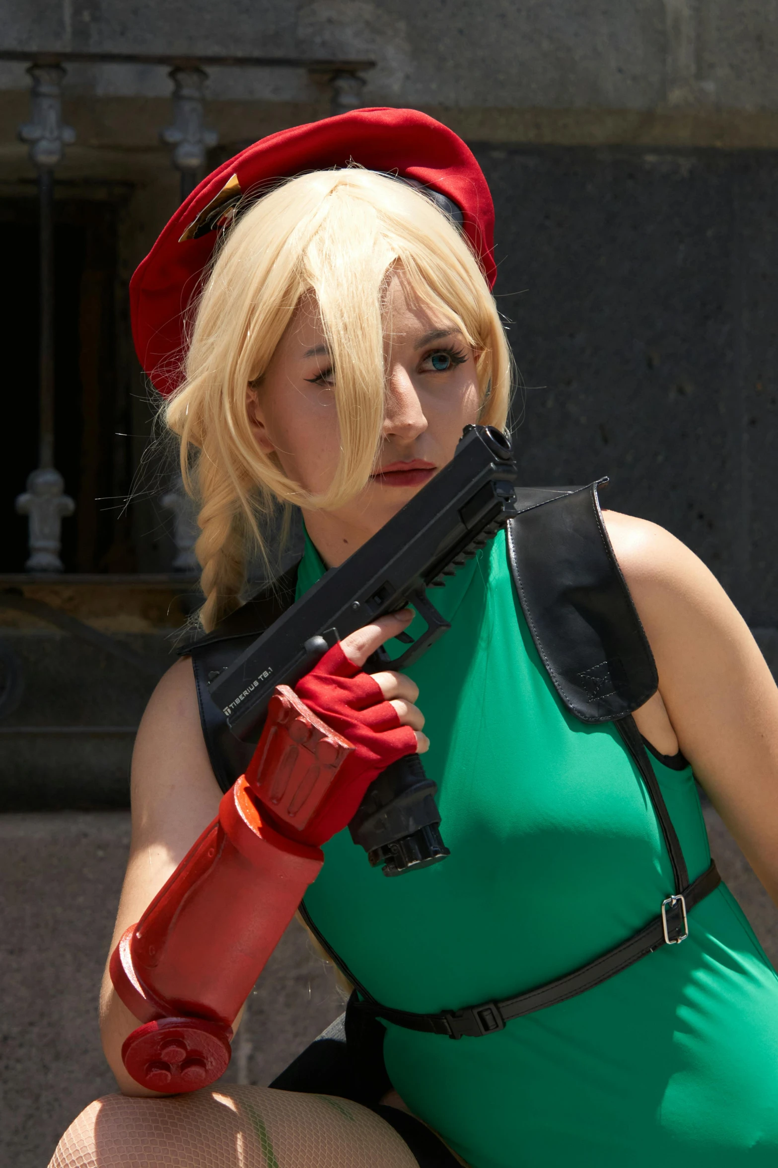 a woman dressed as a soldier holding a toy gun