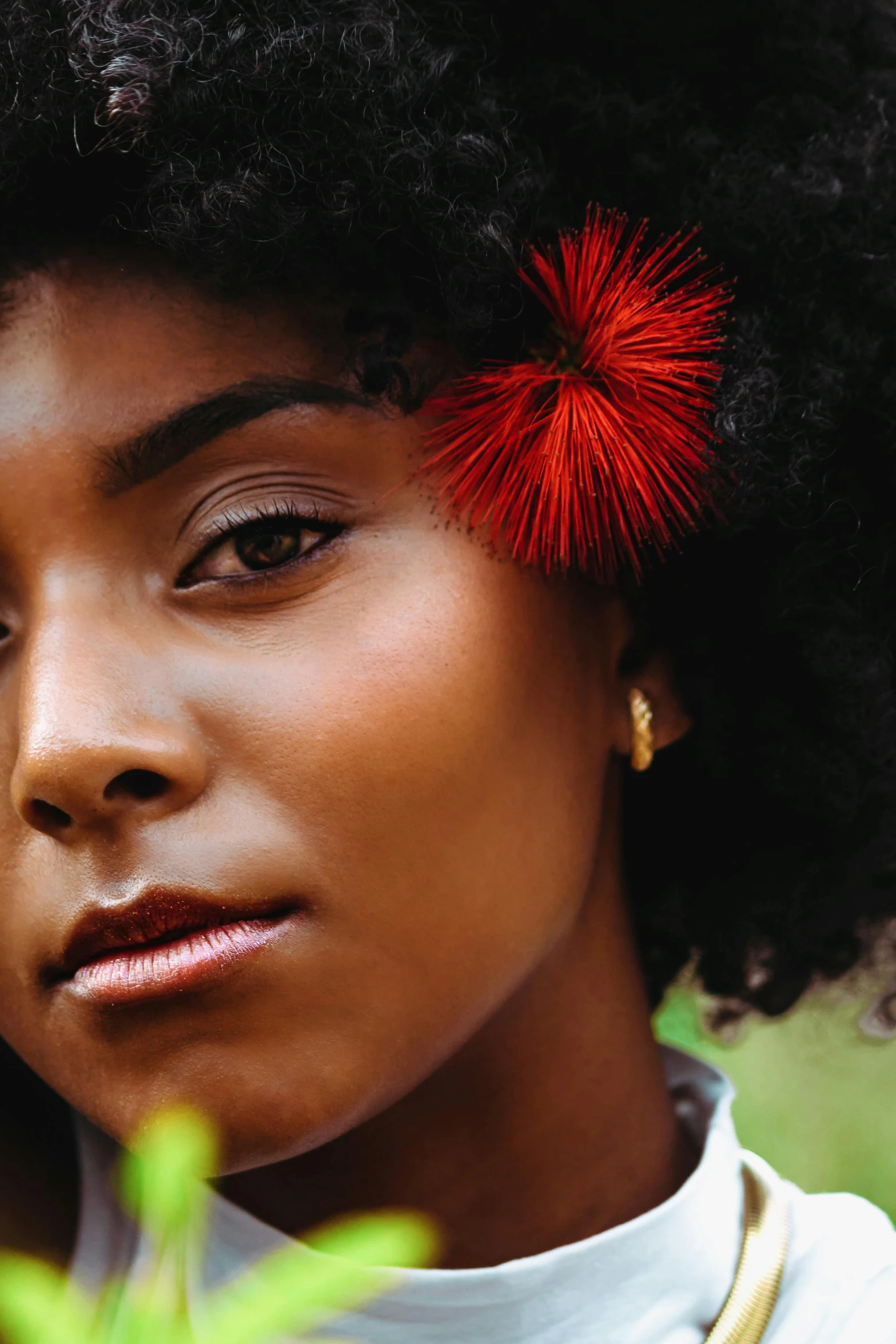 an african american woman with natural hair wearing earrings