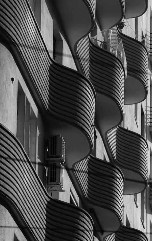 the balconys of the buildings are made from different shapes and heights