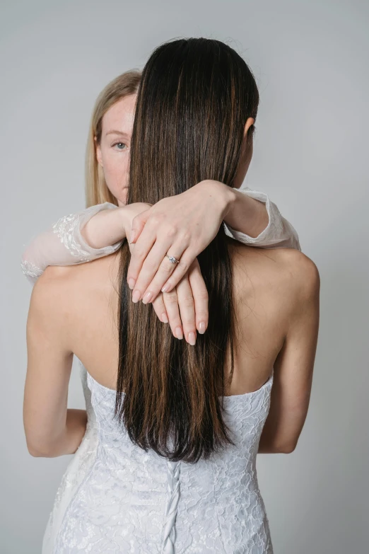 two women holding each other in their arms