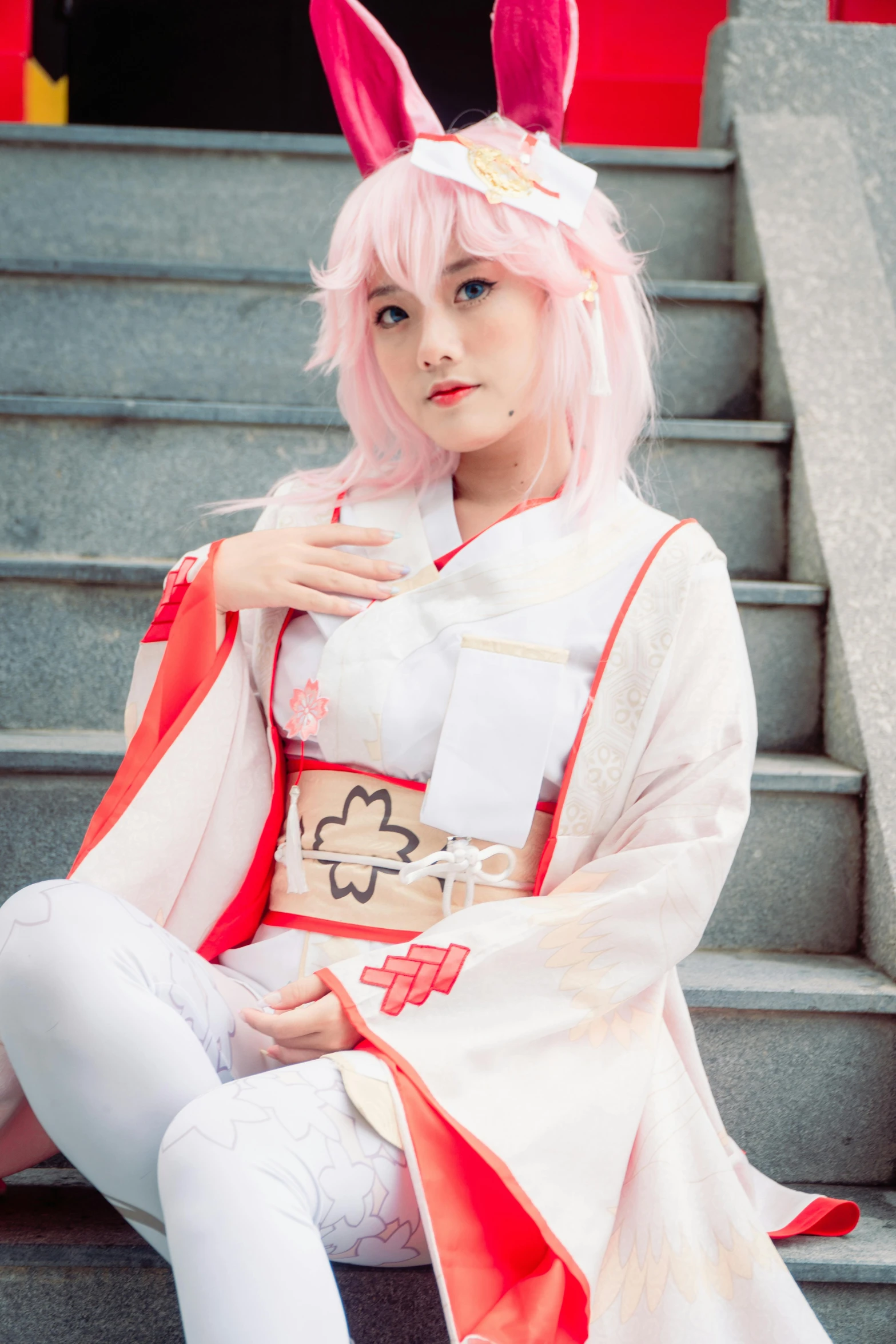 a female wearing a cosplay from anime is posing on a stair case