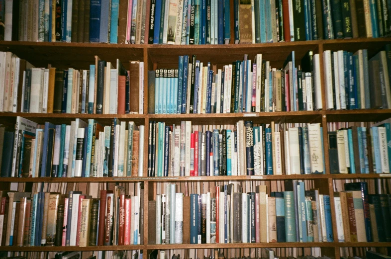 a shelf full of books with a book on it