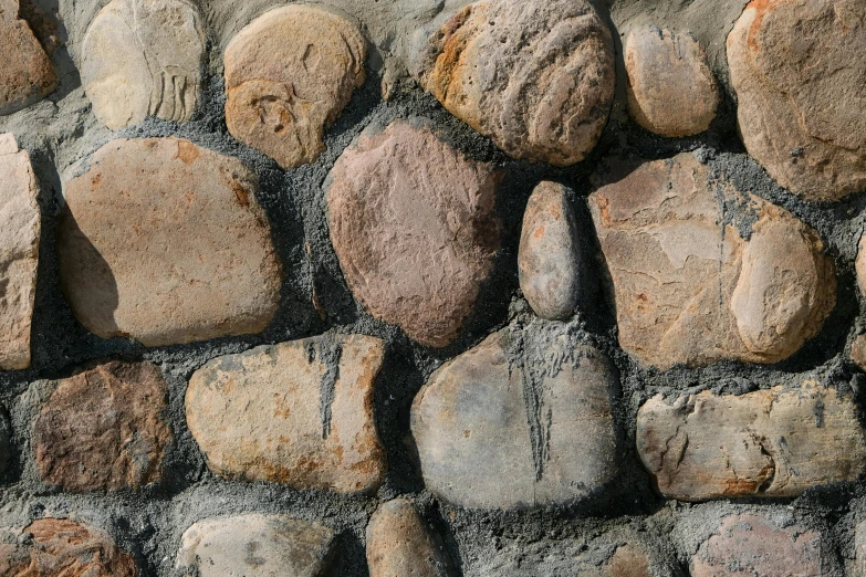 a rocky wall made of stones and gravel