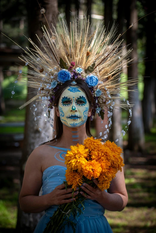 a person wearing face paint with flowers on his head