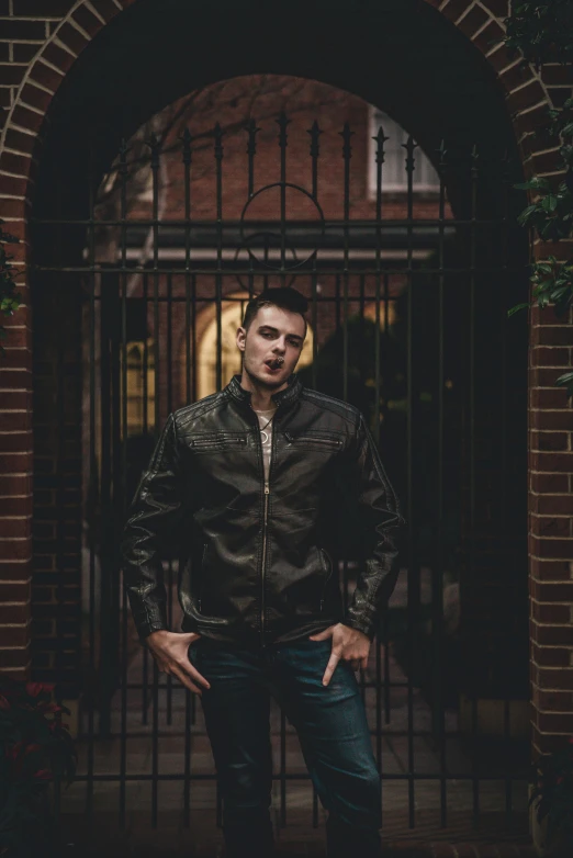 young man posing for pograph in front of a building