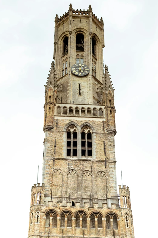 the building with a clock is brown brick