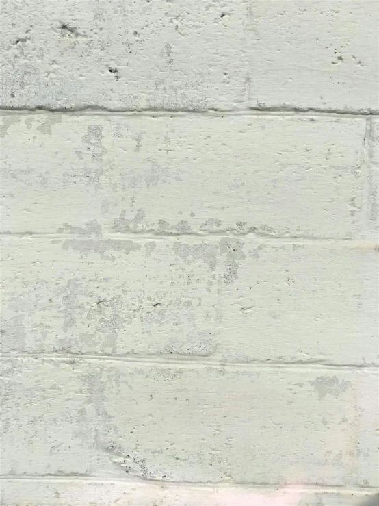 an up close view of a white brick wall