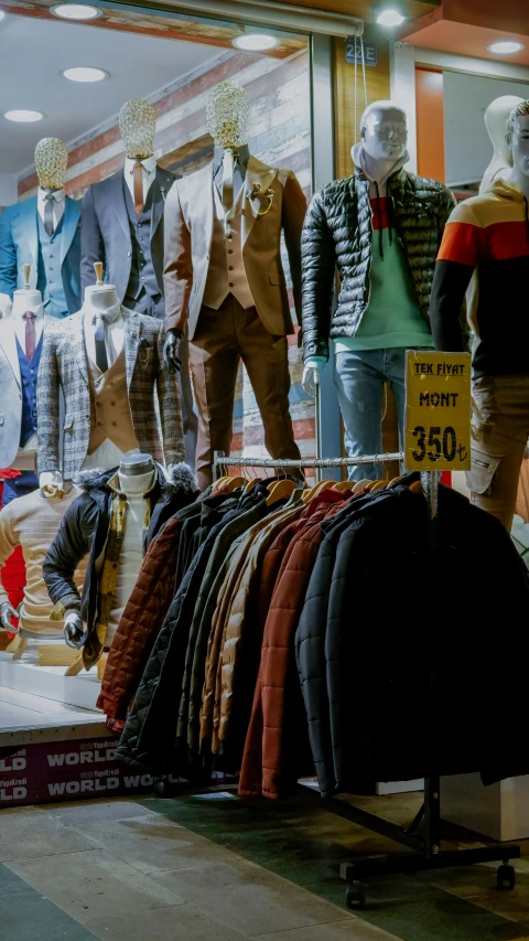 a shop display with mens clothing on a rack