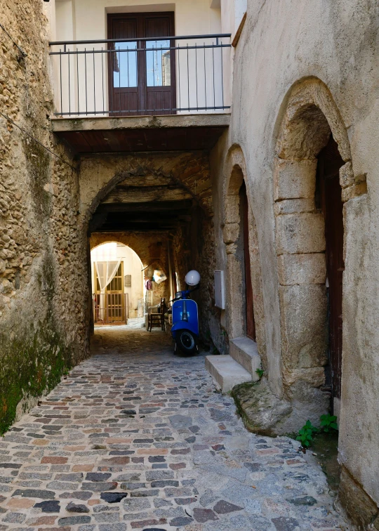 an alleyway that is a long brick building