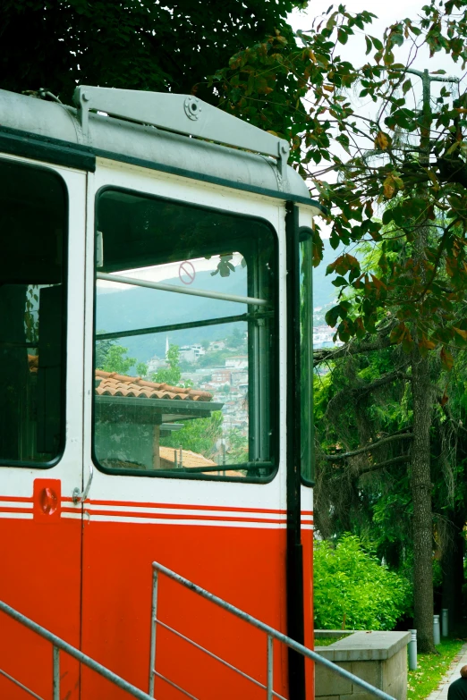 a passenger bus traveling down the road with lots of windows