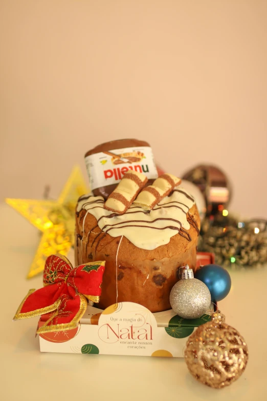 a cake sitting on top of a christmas box