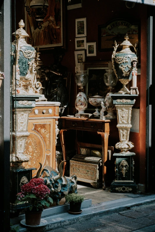 an antique dresser sitting outside of a store