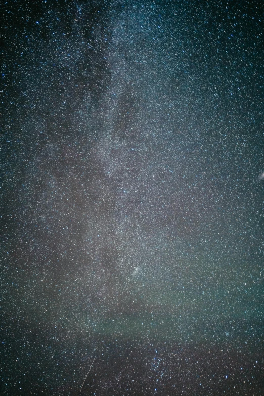 stars are visible in the night sky over mountains