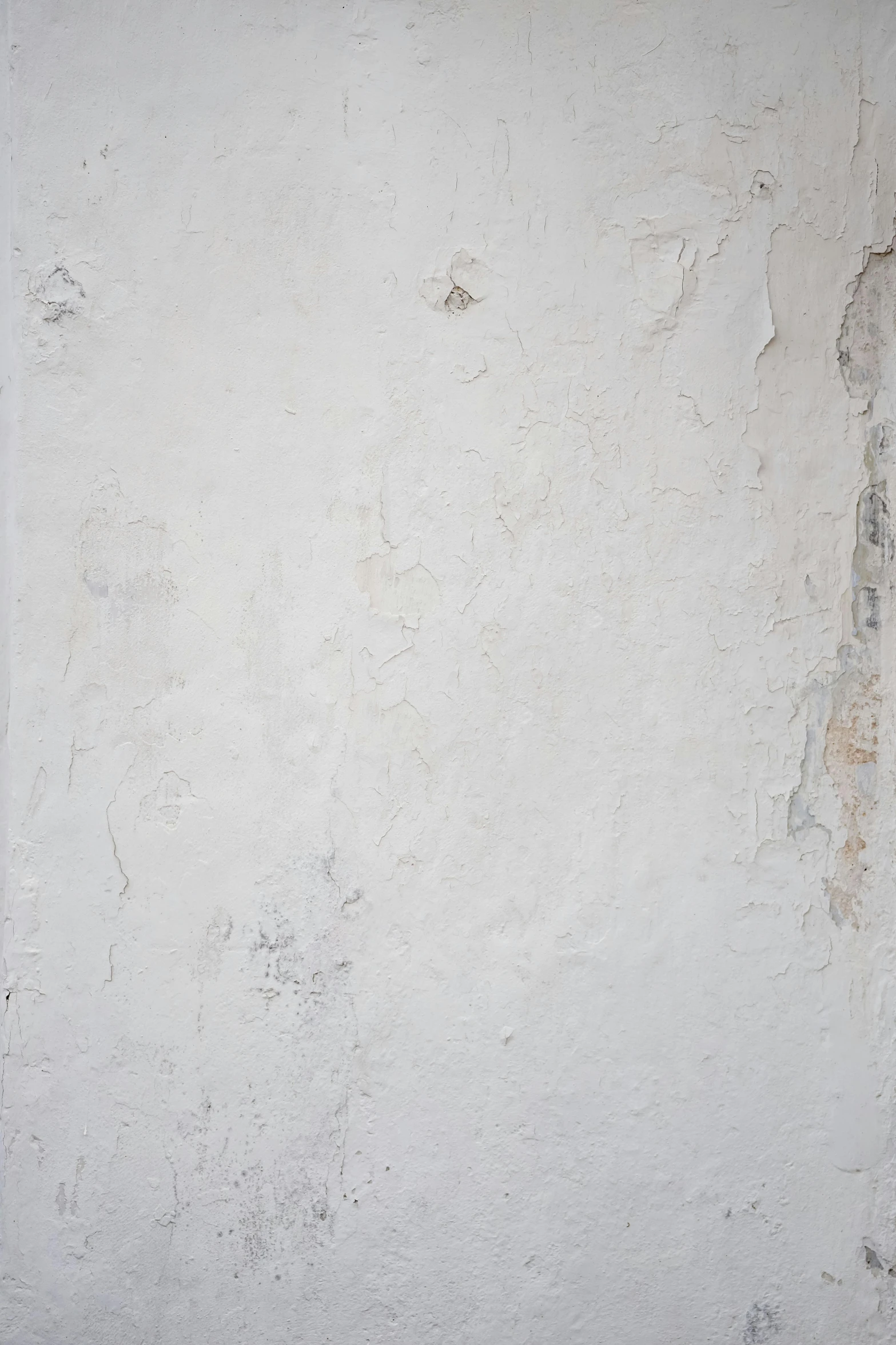 a red fire hydrant in a white concrete wall