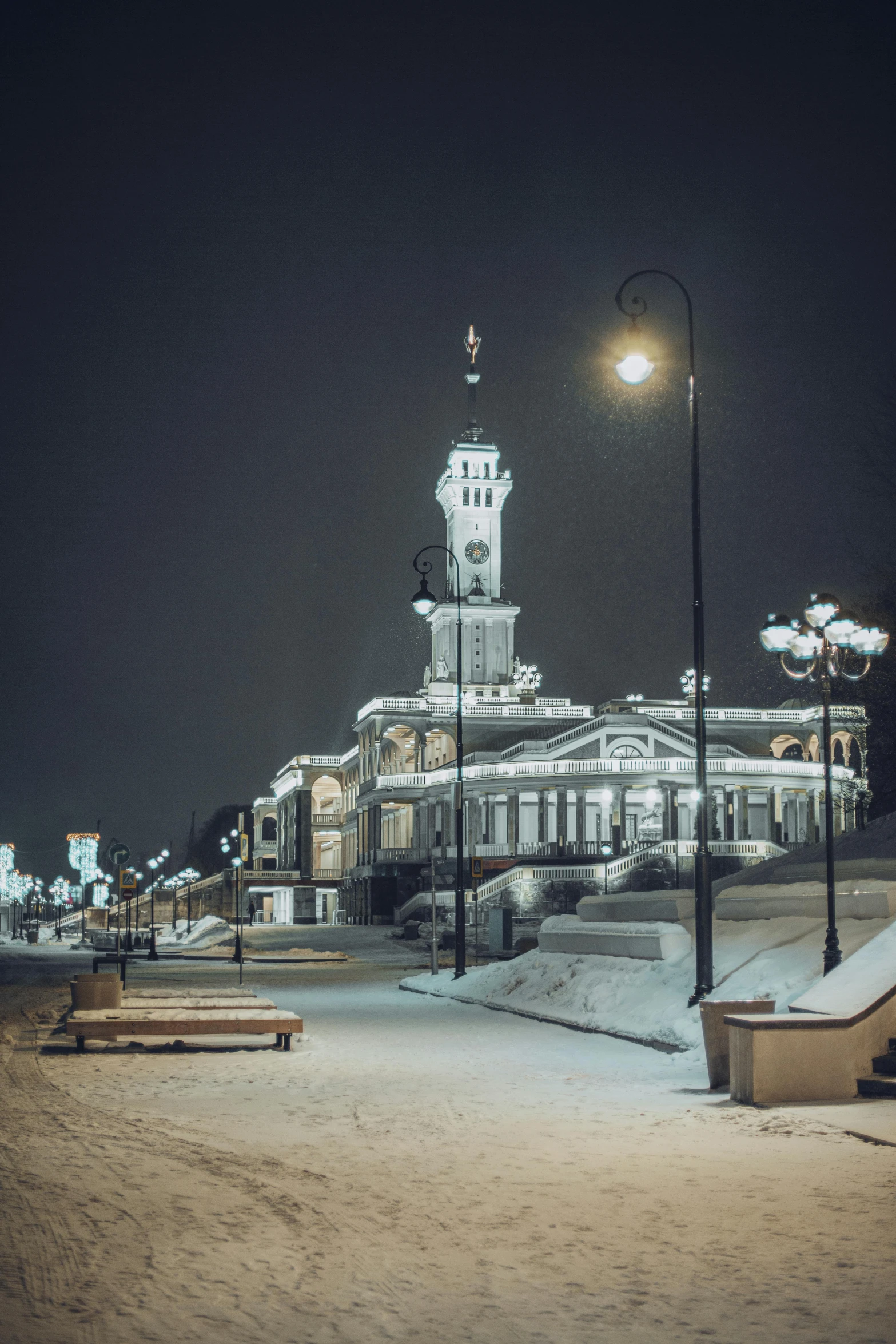 a large building and some snow covered steps