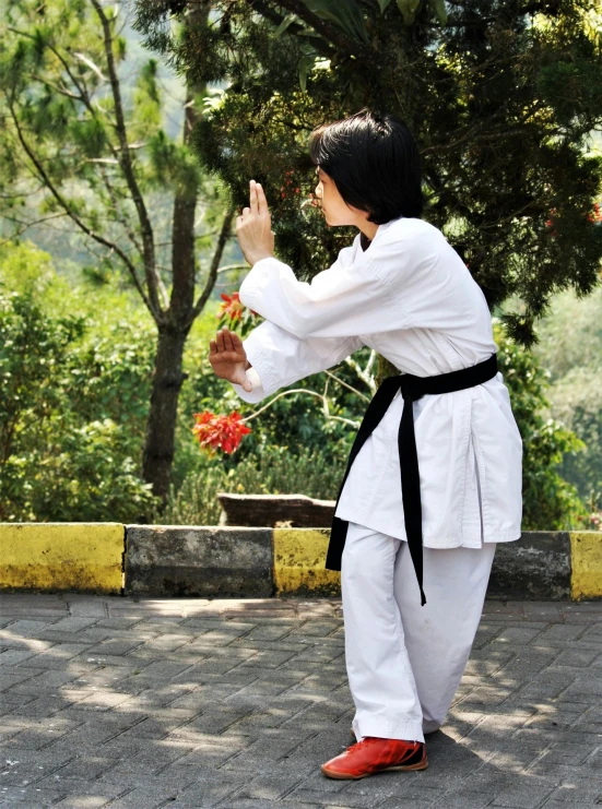 a man is posing in his traditional garb