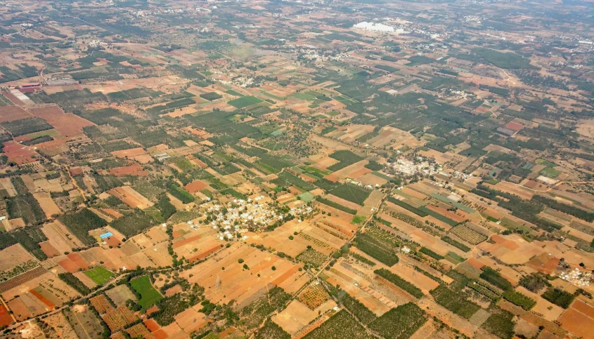 an aerial view of a rural countryside with trees