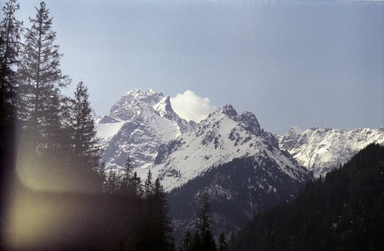 mountain peaks covered in snow, seen from a distance