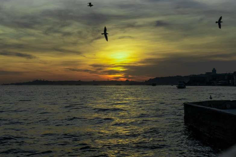 two airplanes are flying over a body of water