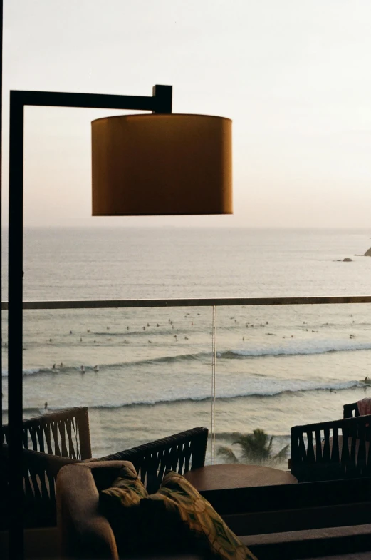 a table with two chairs and a large lamp