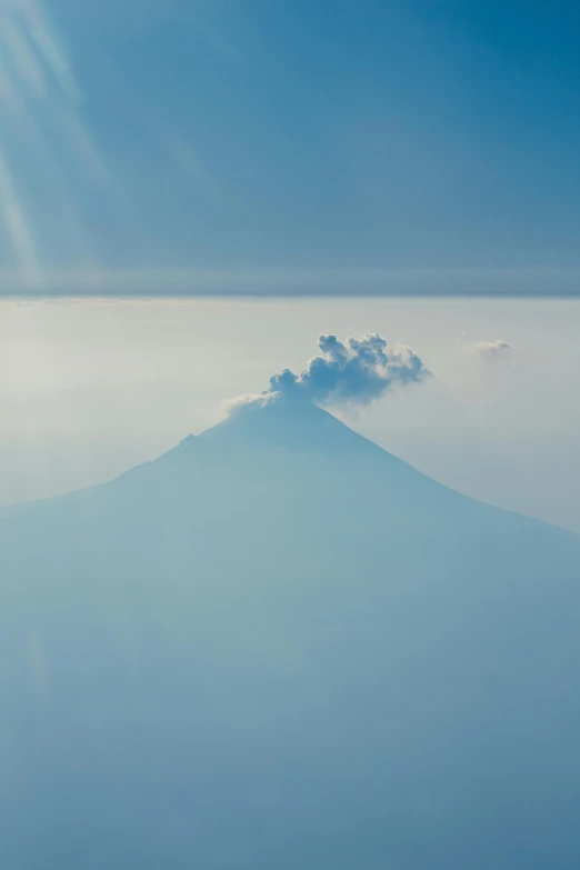 a mountain is seen in the background with clouds around