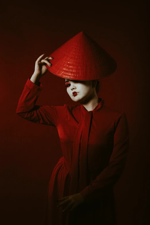 a woman with a big red hat and red lipstick on