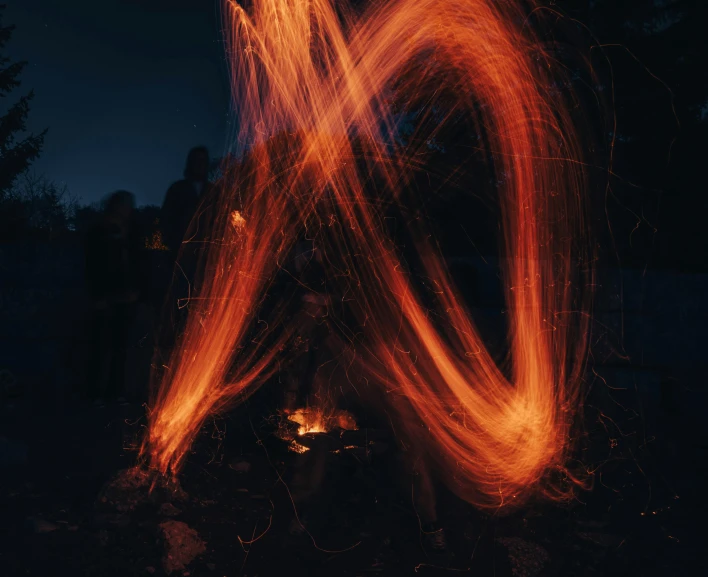 a pograph of the fire at night with many blurred out lines