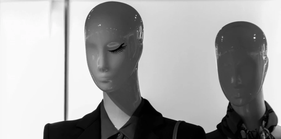 an alien mask is seen next to an artificial person's head