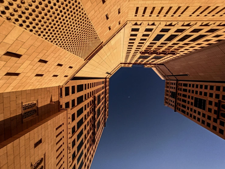 two buildings looking up at the sky