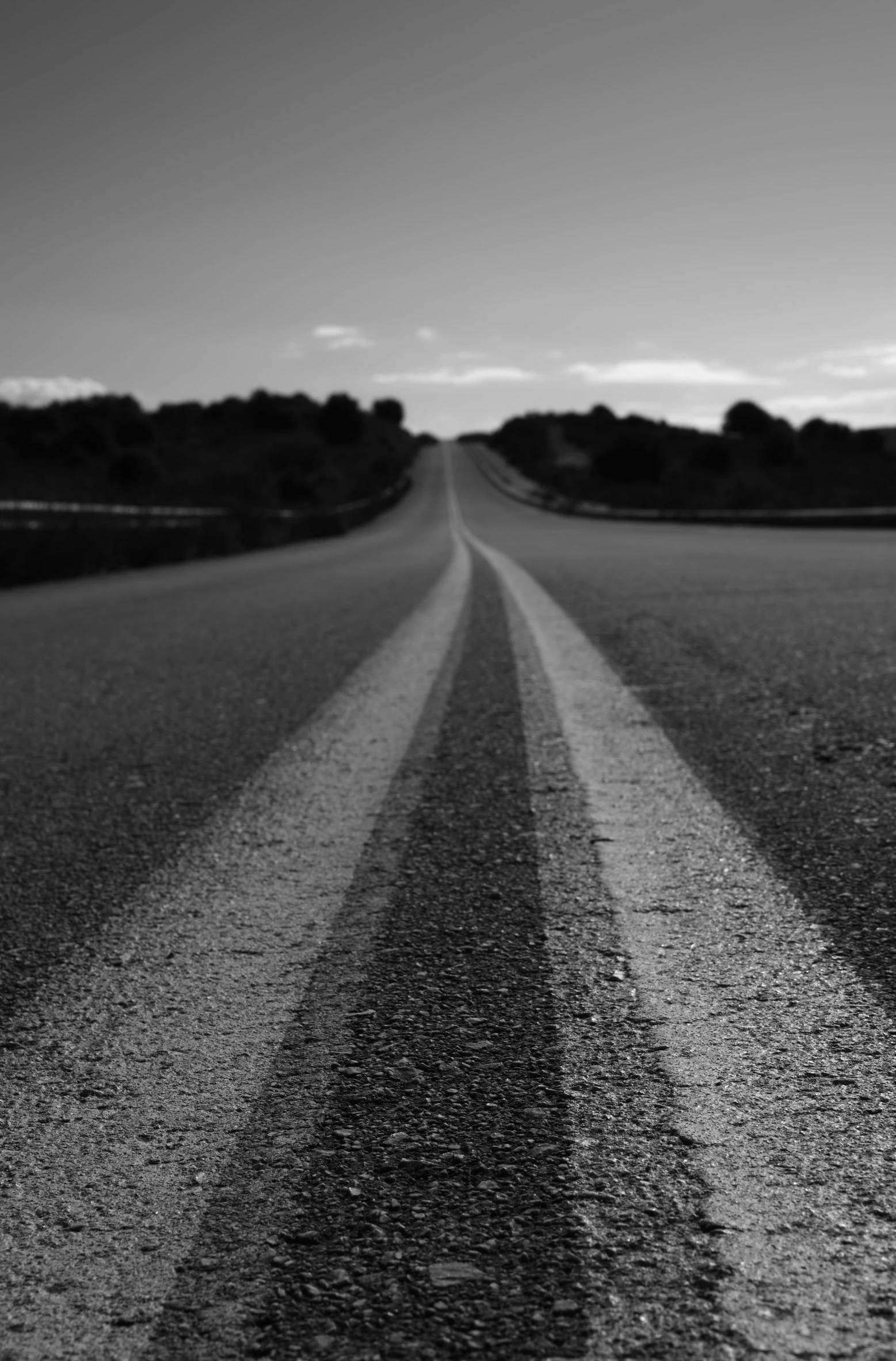 black and white pograph of a paved highway