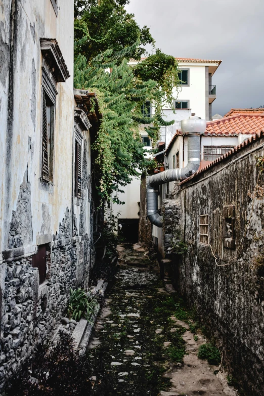 a narrow alley with lots of old buildings