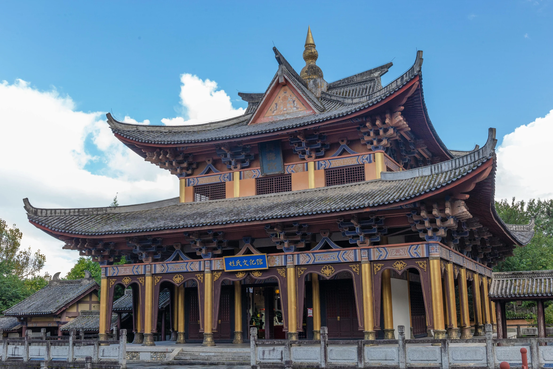 a tall pagoda building is in the middle of a park