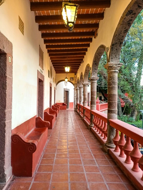 this is an outdoor covered walkway that overlooks the woods