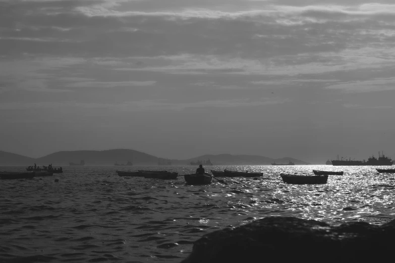 many small boats are in a body of water