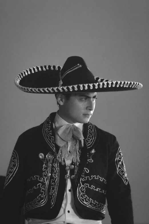 a young man in a large sombrero hat