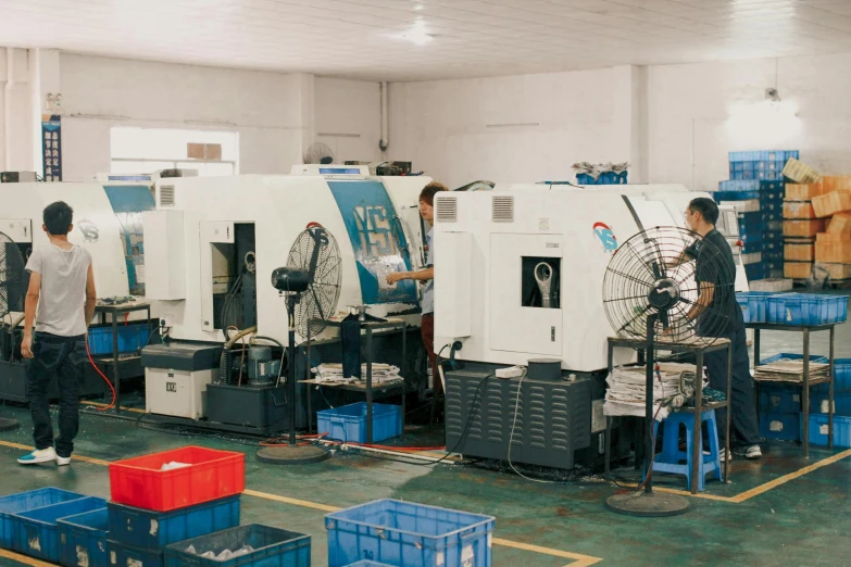 an assembly line with workers in the process