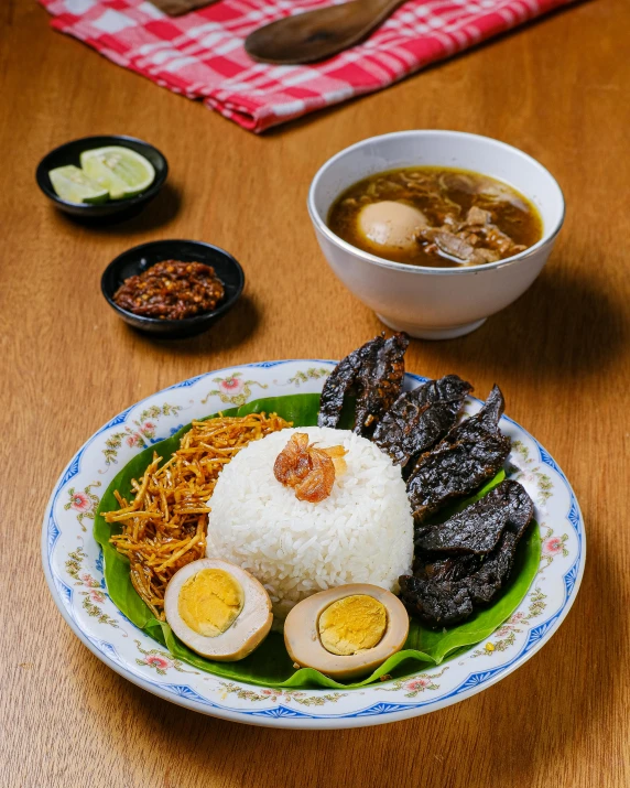 a bowl of food on top of a green and white plate