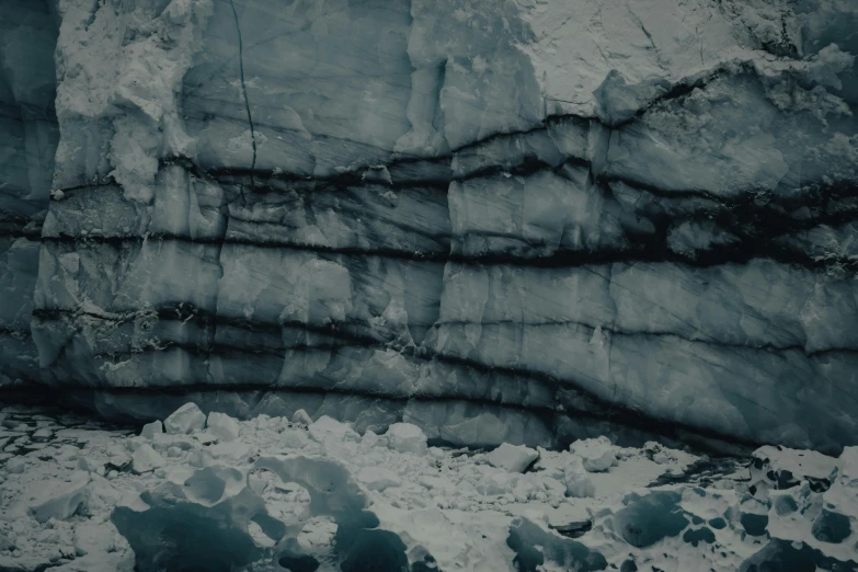 a man is in front of a waterfall of ice