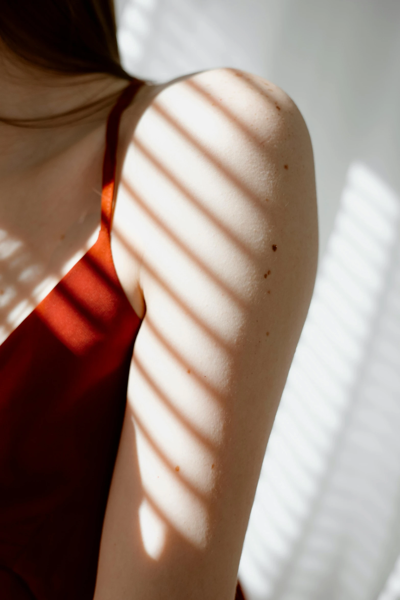 the back view of a person wearing a red 