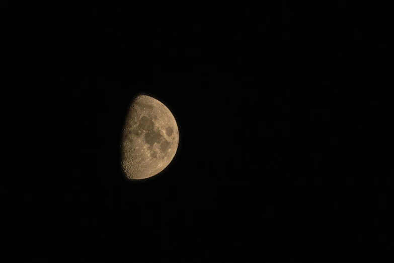 the moon is showing up in the night sky