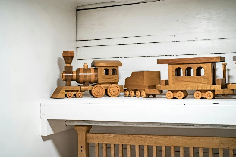 a toy train set sits on the mantle