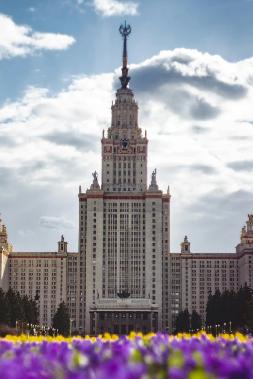 a large building with several towers, some on the roof