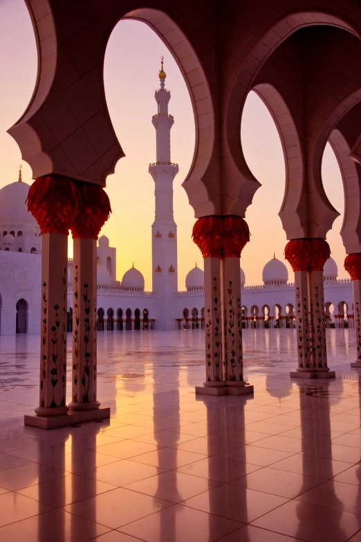 an empty, white tiled room at the end of a mosque