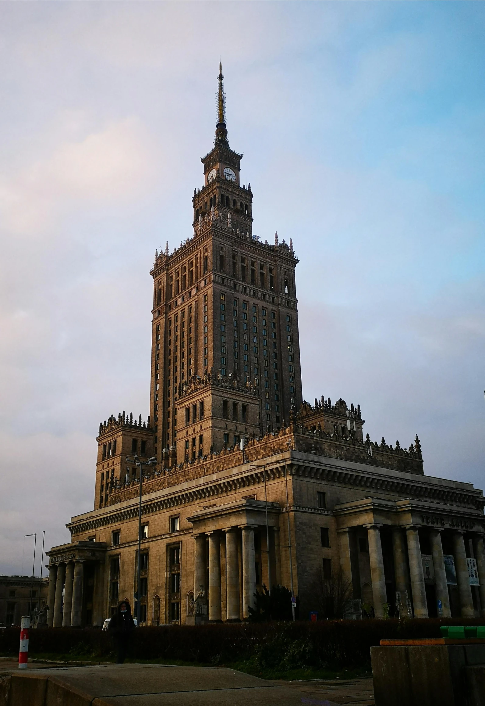 an old building with several pillars and a tower