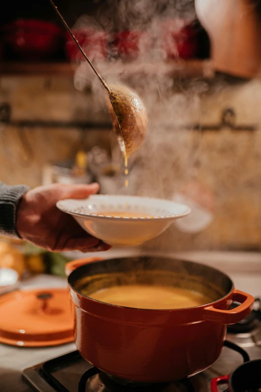 an image of someone preparing food on the stove