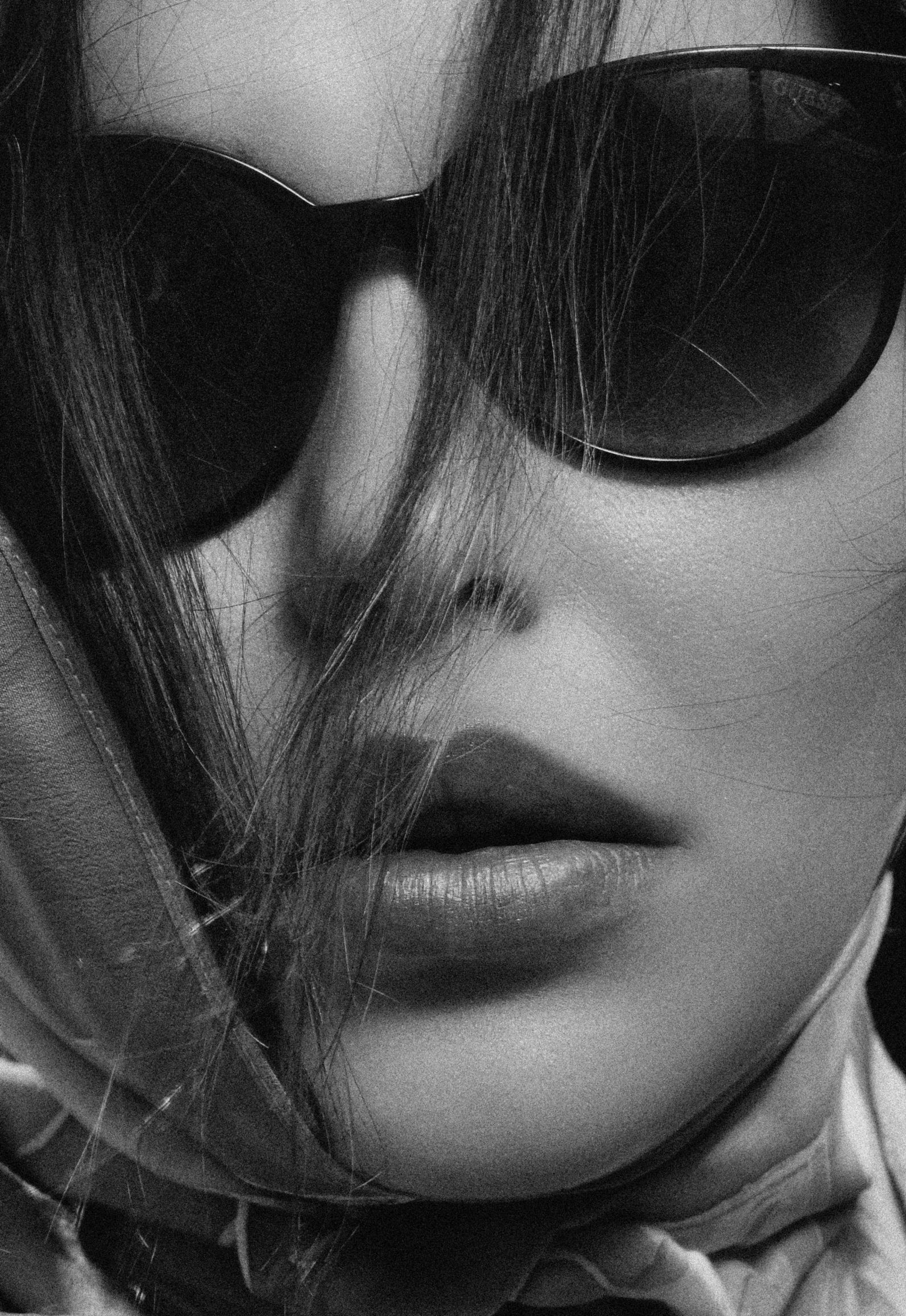 black and white po of woman wearing sunglasses