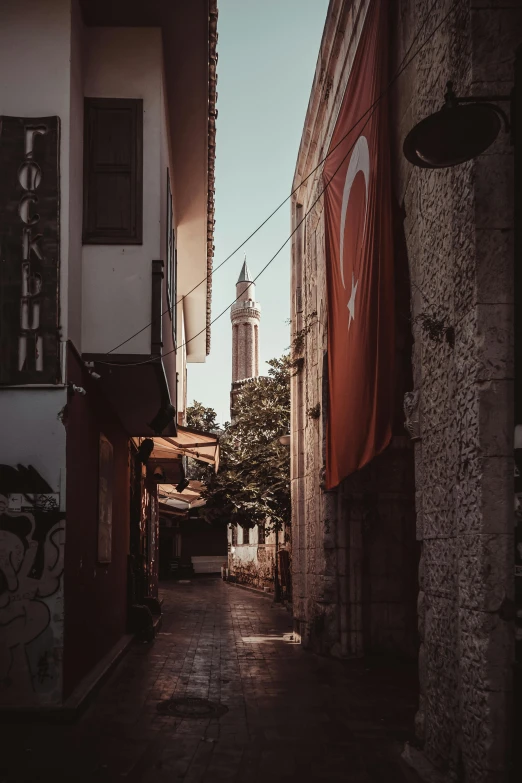 a city with two flags hanging on a building