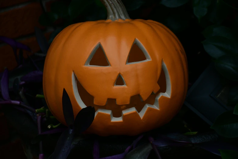 the jack o lantern pumpkin has two small faces