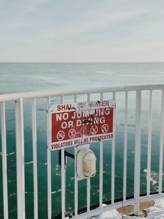 an image of a sign on a railing